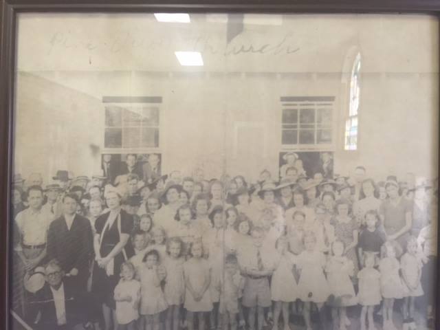 A packed congregation inside the original Pine View Missions building